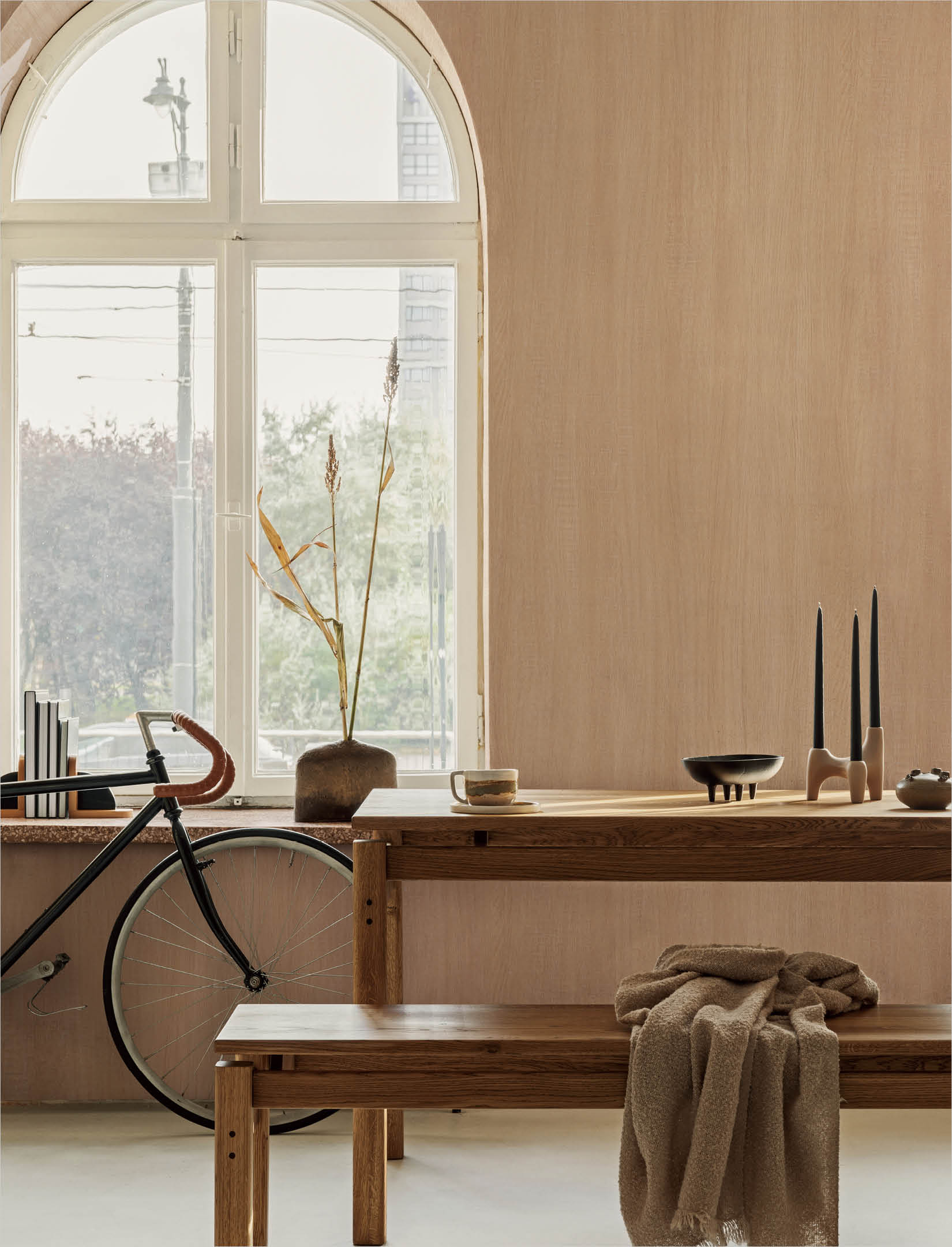 Creative composition of elegant dining room interior design with wooden family table, bench and rustic inspire home decorations. Modern home concept. Retro inspiration. Structure wallpaper. Template.